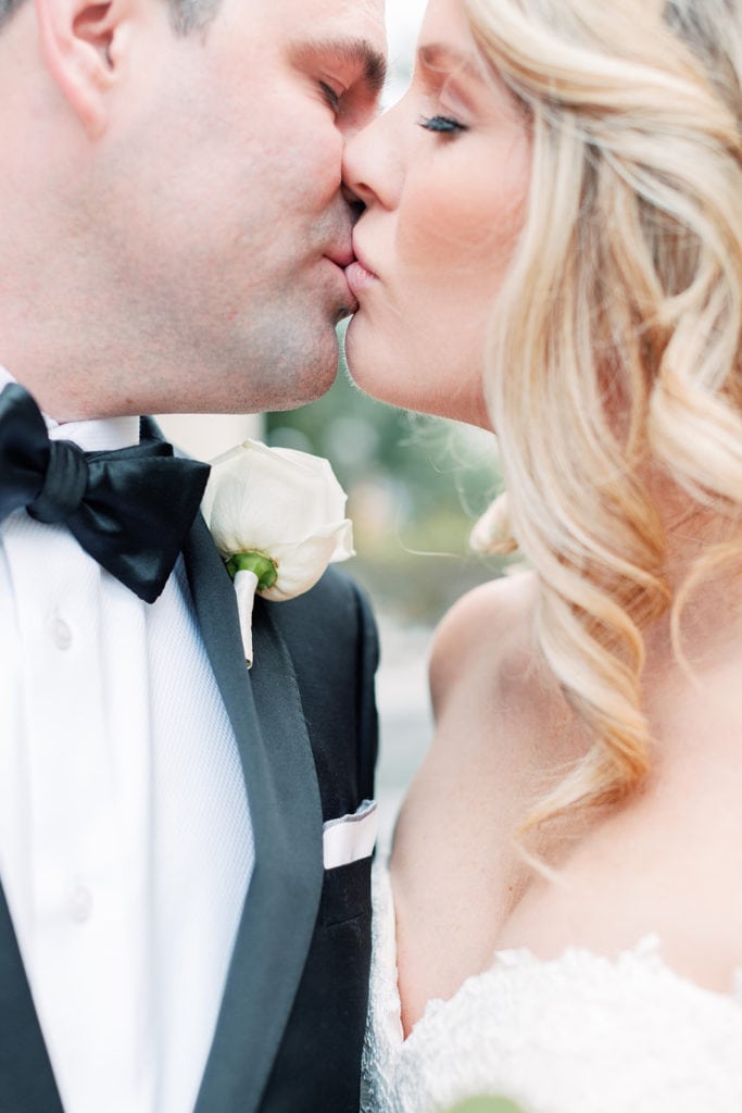 Close up of bride and groom kissing