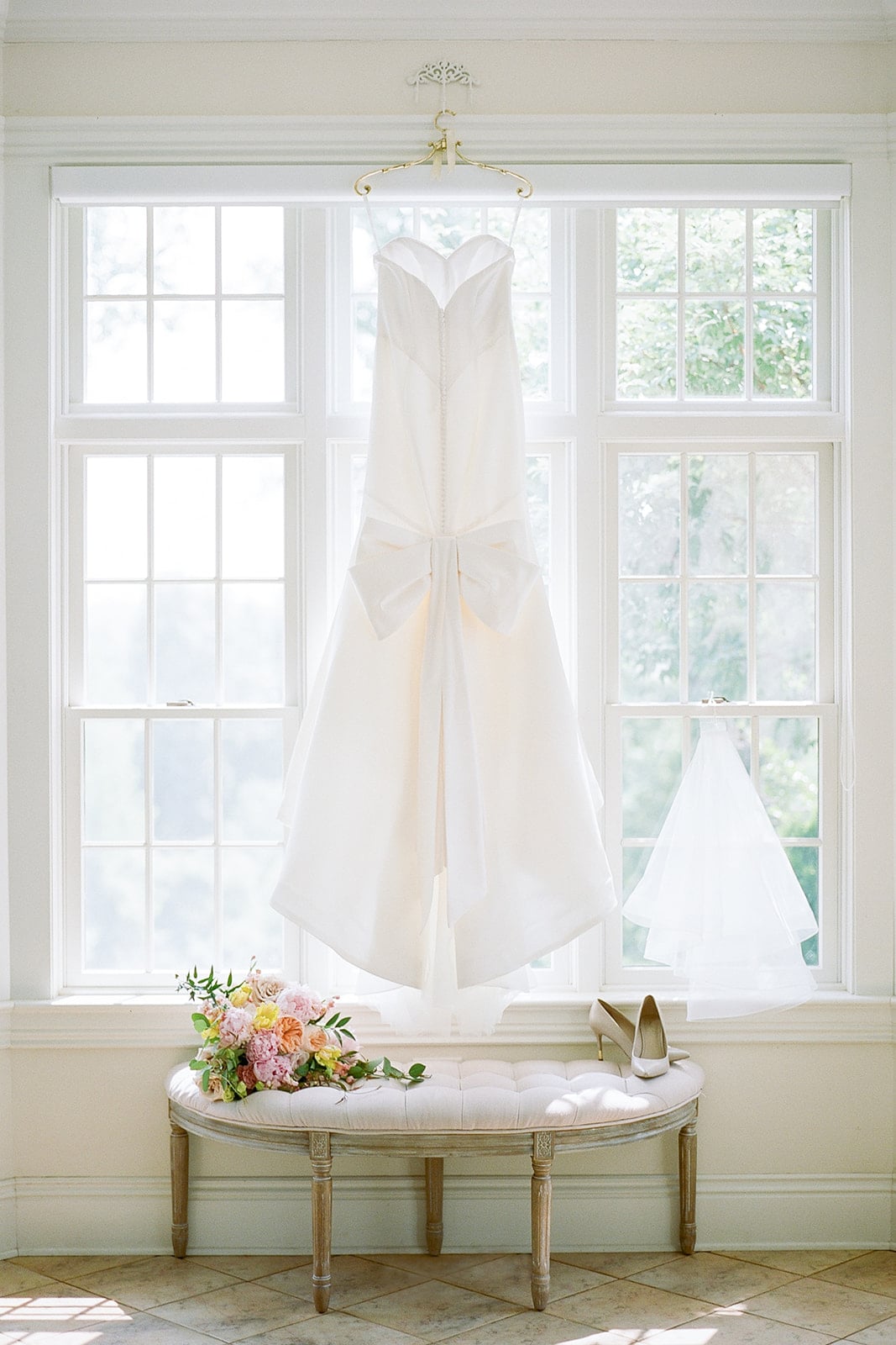Wedding dress portrait: How much should you invest in a wedding photographer by Lauren Renee