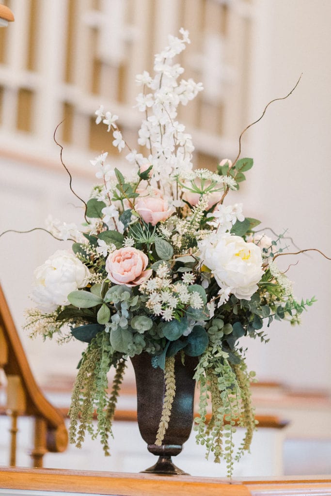 Pink and white wedding ceremony flowers