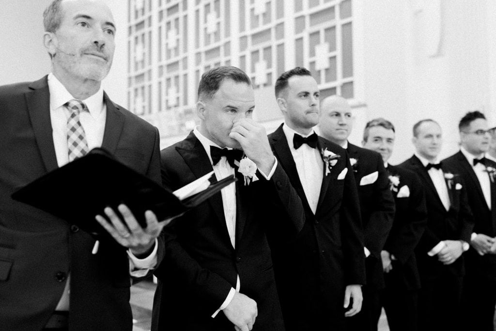 Groom's reaction to bride walking down the aisle