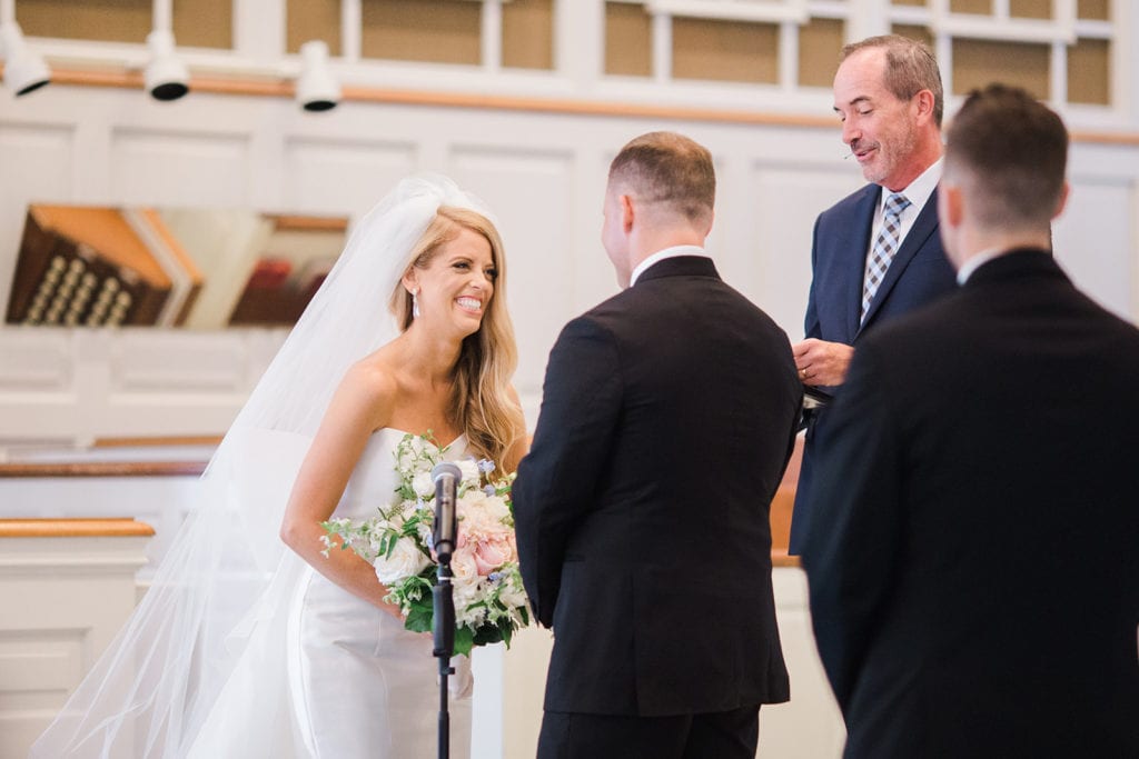 Bride and groom exchanging vows during Fox Chapel wedding