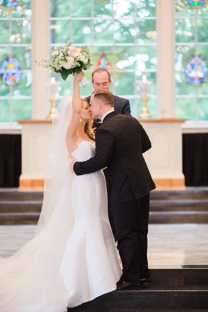 Bride and groom kissing during Fox Chapel wedding