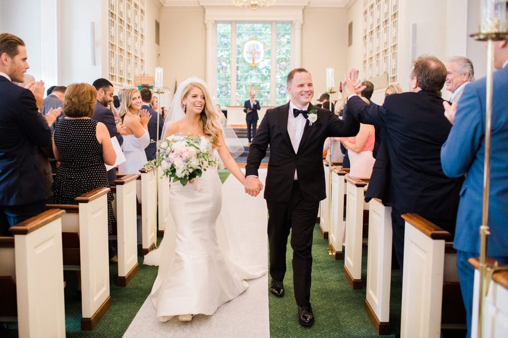 Bride and groom exiting wedding ceremony as Mr. & Mrs.