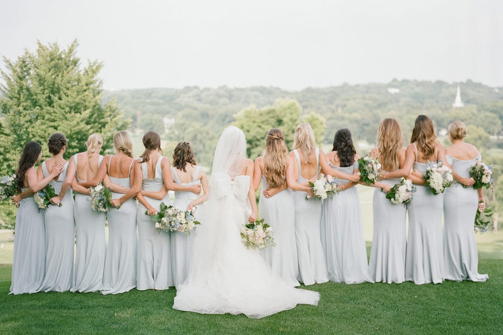 Bride and bridesmaids posing with bouquets