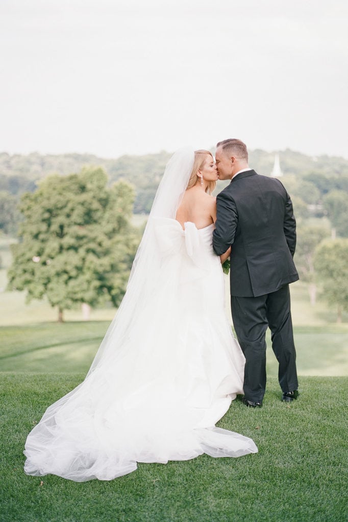 Bride and groom kissing wedding portrait