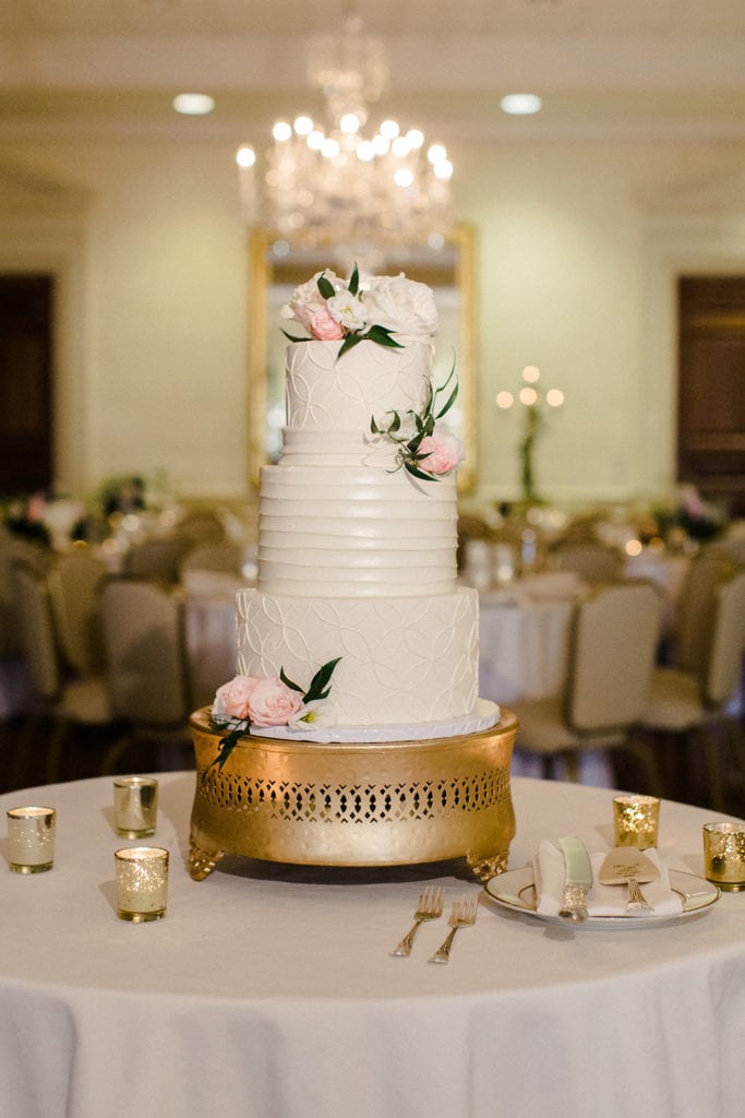 Classic white wedding cake with pink flowers