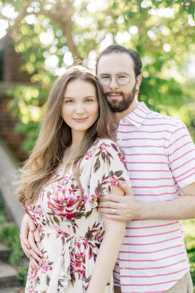 man and woman pose while wearing pink