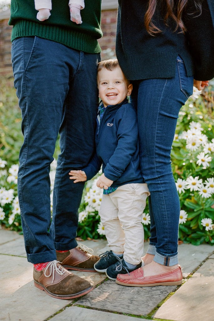 Toddler posing for fall family photos