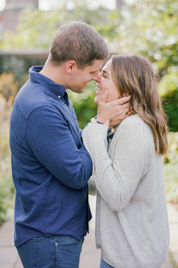 Couple laughing during fall photo session at Mellon Park