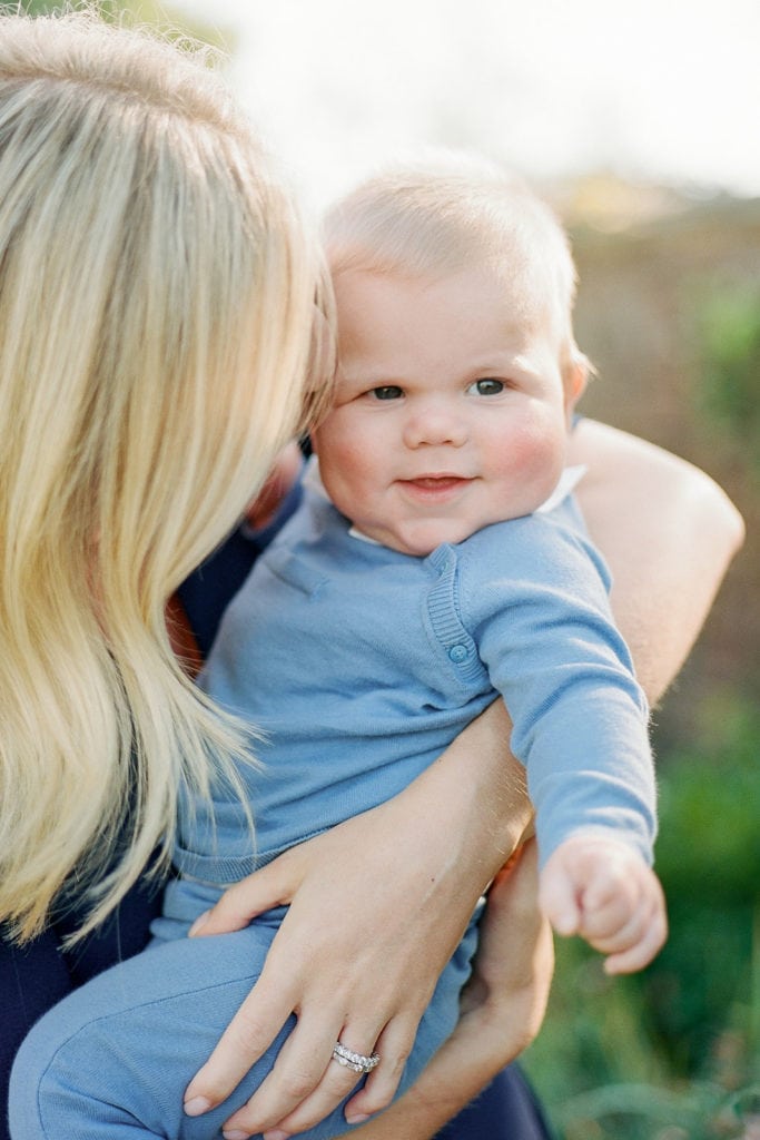 Baby smiling during family photos with Lauren Renee