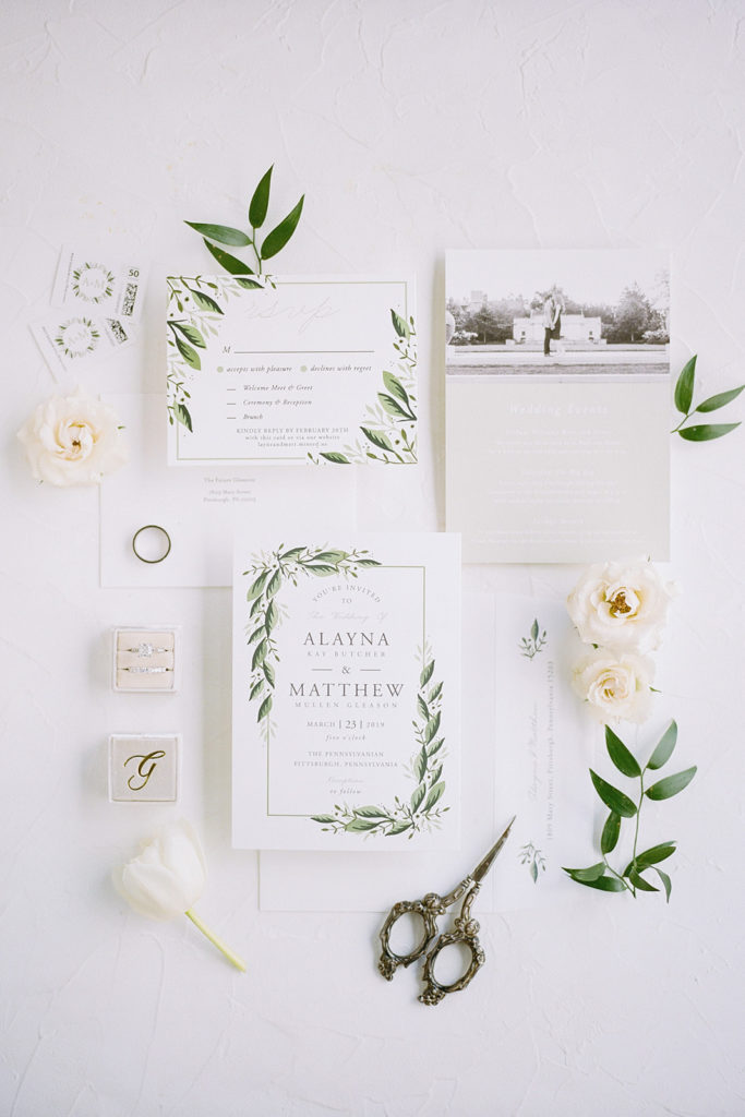 White Wedding invitation with greenery accents