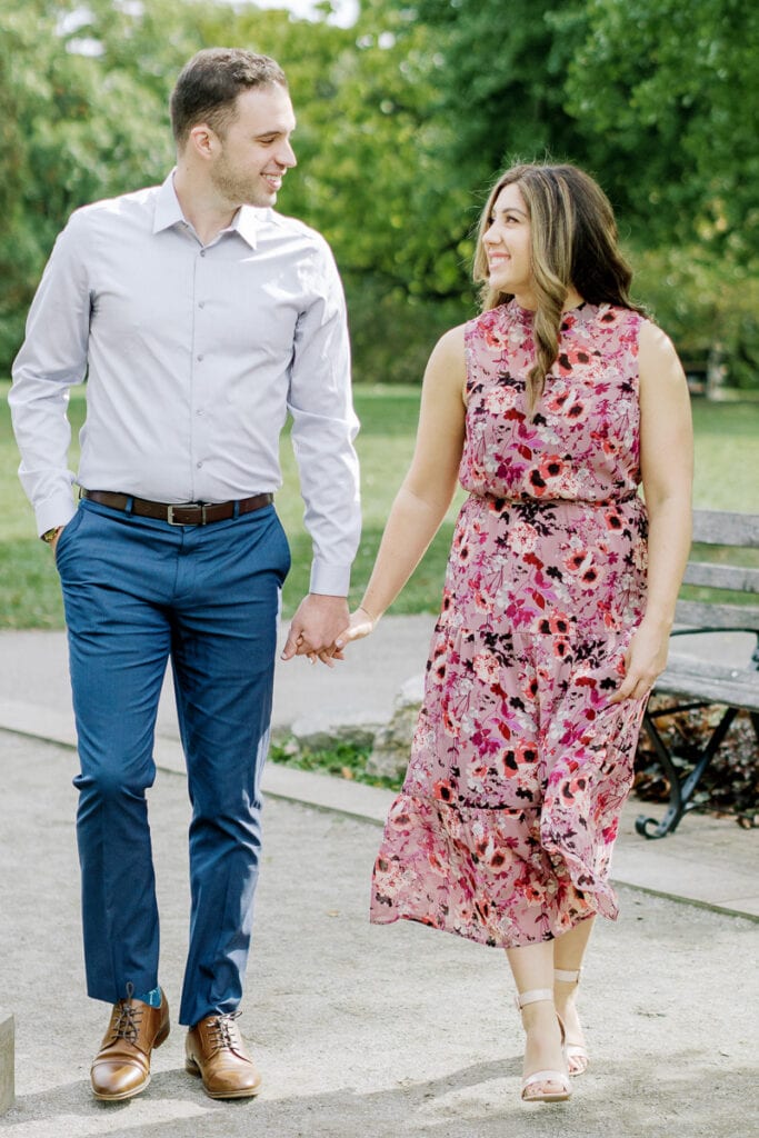 Couple holding hands through Mellon Park