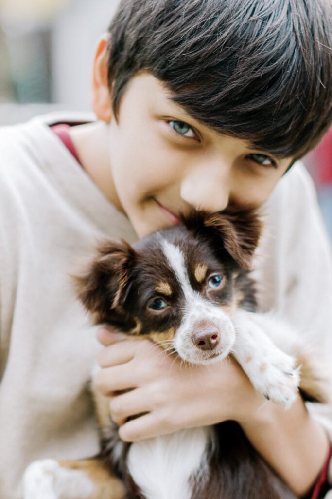 Little boy holding his dog