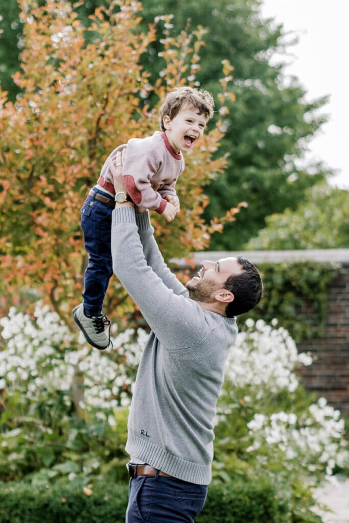Dad holding his son up in the air mini sessions at Mellon Park