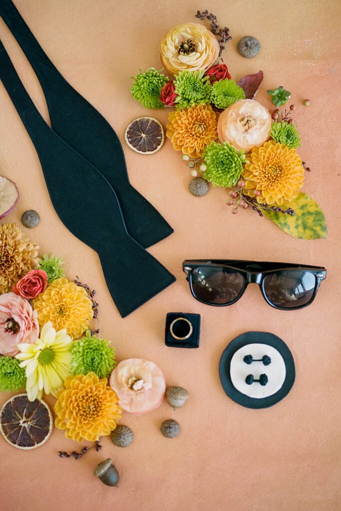 Groom's bow tie and sunglasses