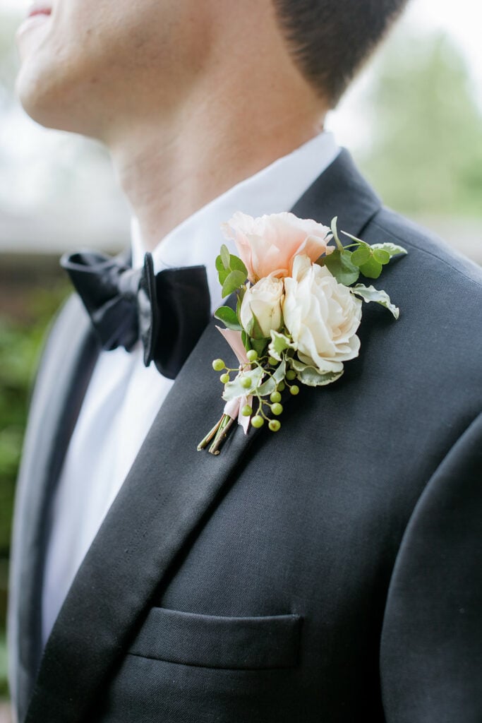 White and peach wedding boutonniere