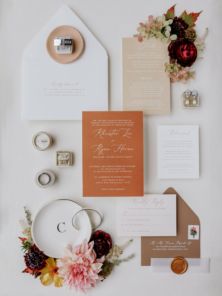Photo of terracotta and fall wedding invitations for a Pittsburgh tented wedding.
