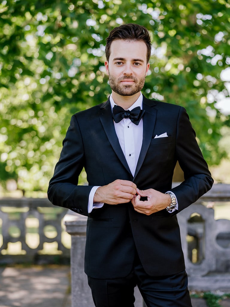 Photo of groom in a tux at a Pittsburgh wedding. Modern Black and White Wedding