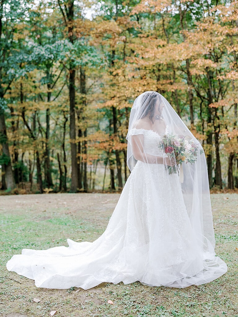Photo of a bride in Pittsburgh at a fall wedding. Pittsburgh Fall Tented Wedding on a Private Estate