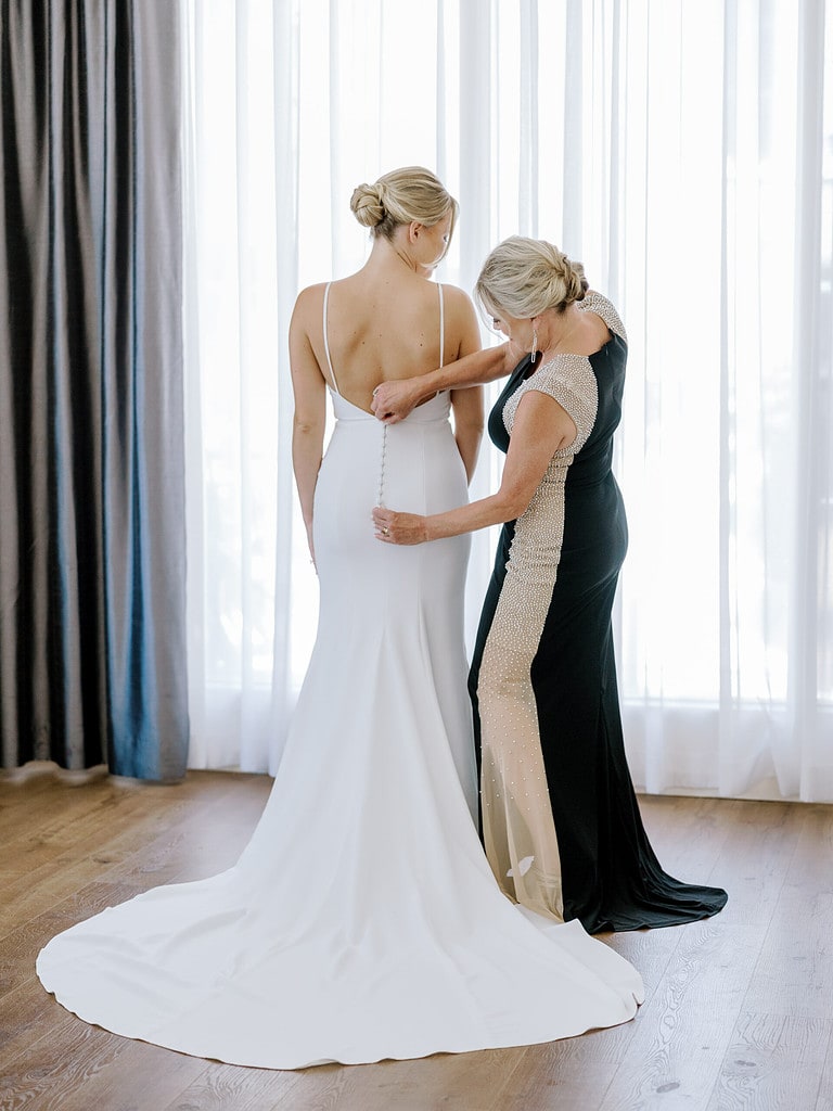 Photo of bride and her mother getting ready for a Pittsburgh wedding.