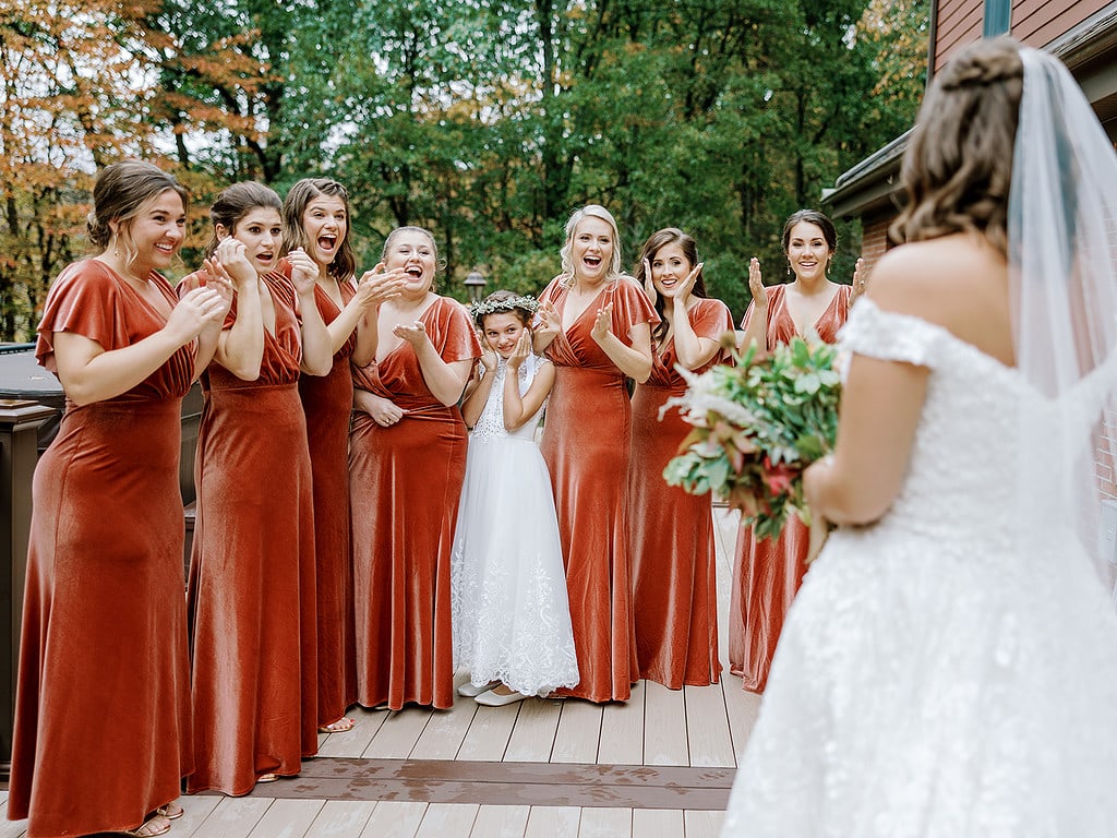 Photo of bride having first look with her bridesmaids in Pittsburgh.