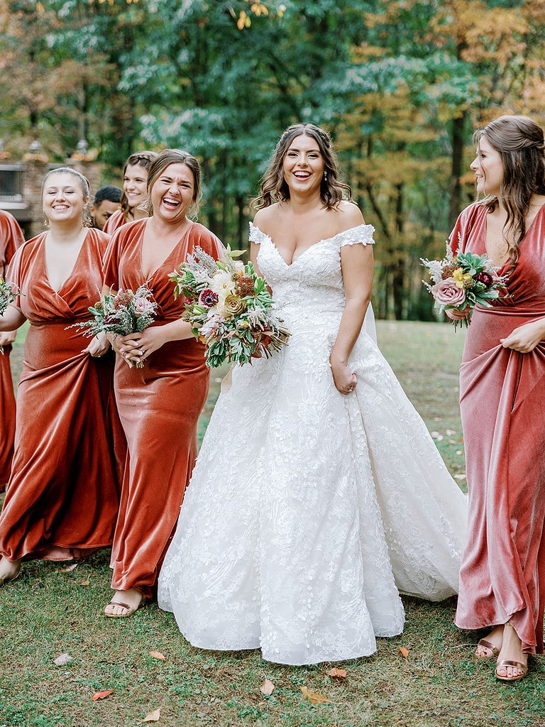Photo of bride and bridesmaids at a terracotta fall wedding.