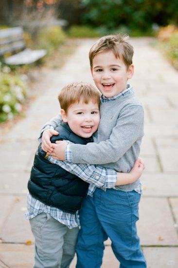Children and brothers hugging each other
