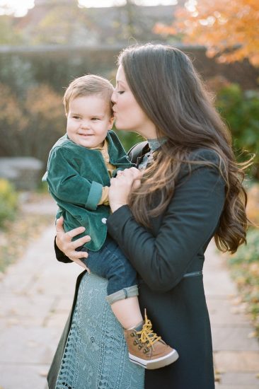 Mom kissing her young son on the head during portraits