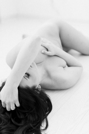 woman laying on the ground nude black and white photo: Pittsburgh Boudoir Photography