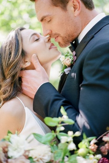 close up of a bride and groom kissing