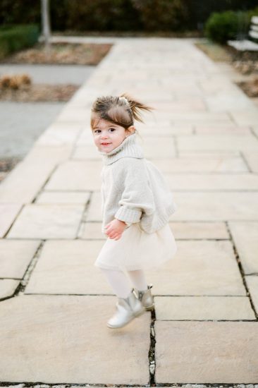Little girl running through the park
